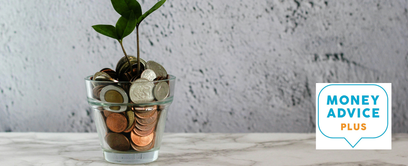 A glass full of coins with a plant growing at the top to depict growing saving with good financial knowledge.